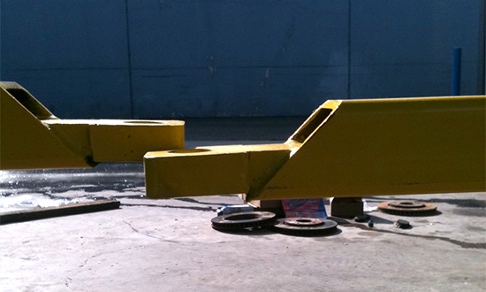 Unleveled Two-Post Hoist Before Shims