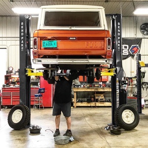 Standing Under BendPak Two Post Car Hoist